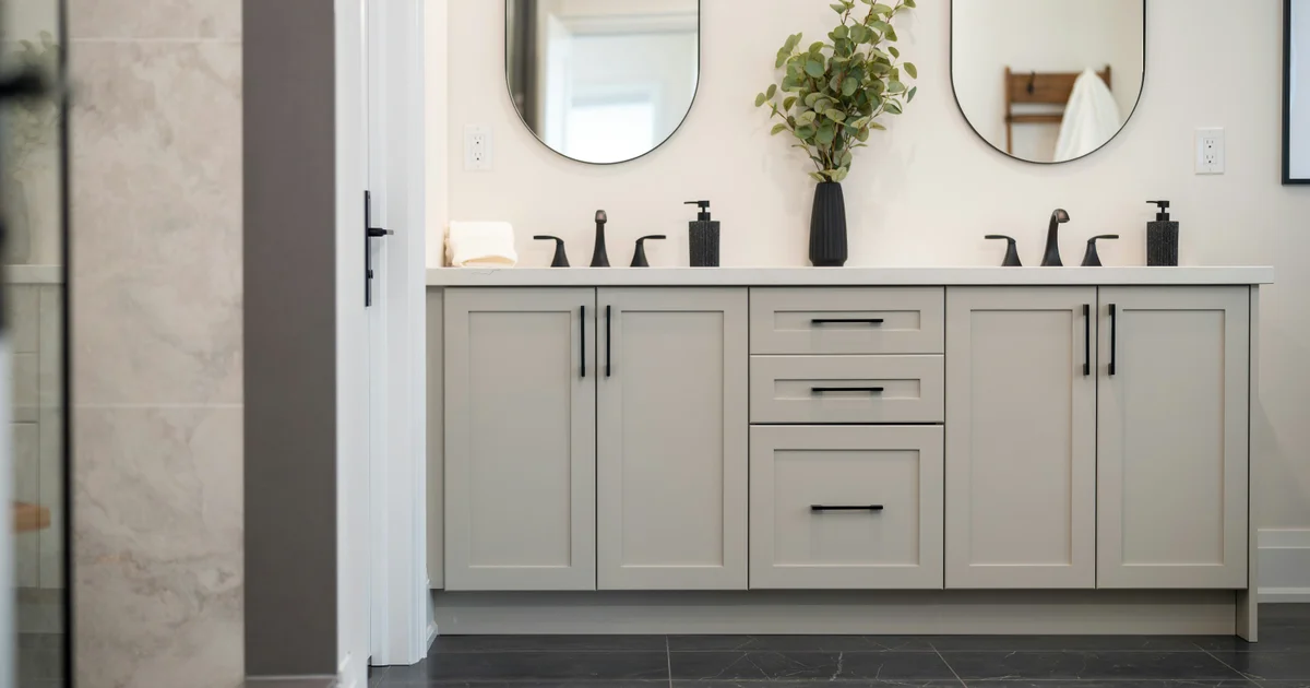 Modern minimalist Scandinavian bathroom with large mirror and elegant sink