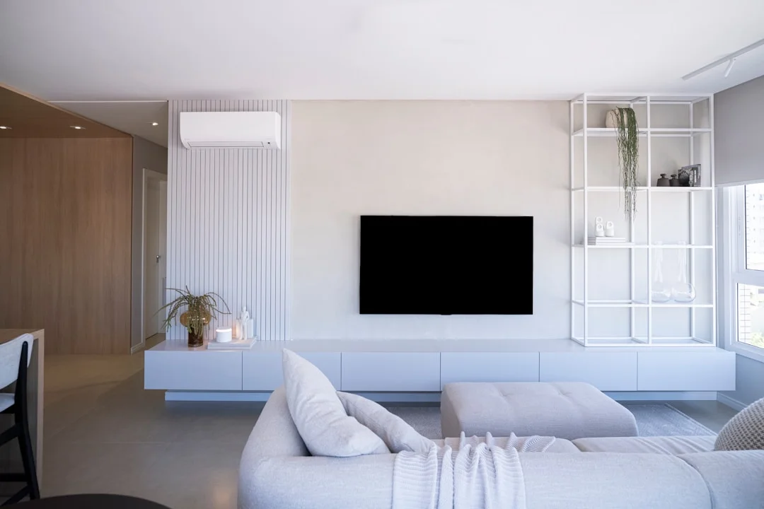 Modern bright living room with white furniture and optimal thermal comfort